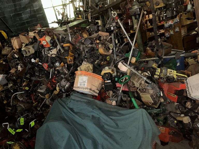 Large collection of used chainsaw pieces and parts image