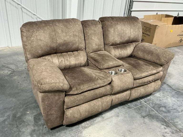 Dual reclining sofa with cupholders and storage image