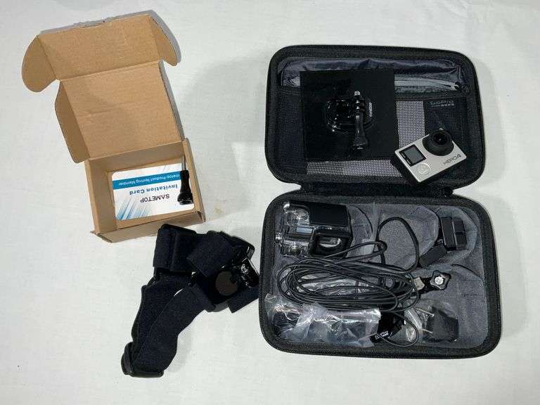 GoPro Hero 4 with mounting accessories, carrying case, straps, cables, etc. image