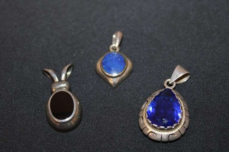3 Sterling Silver pendants with blue and black stones. image