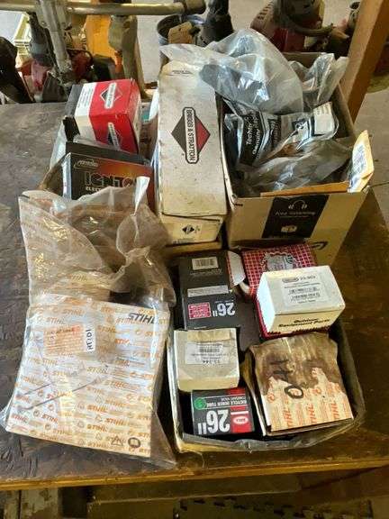 Assortment of new small engine parts image