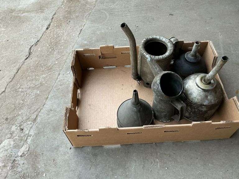 Vintage metal funnels and oil cans image