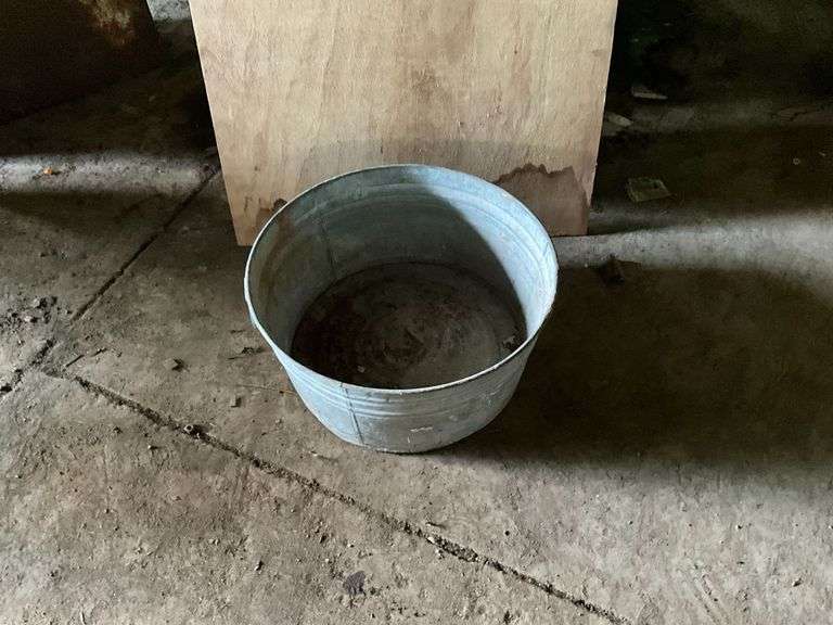 Galvanized tub, small rust holes in bottom image