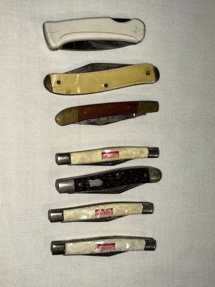 Assorted pocket knives, advertising image