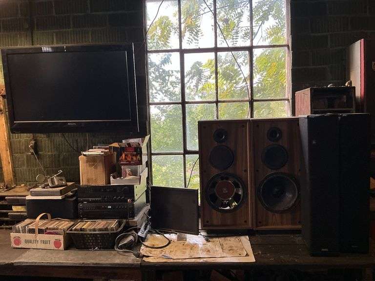 Phillips TV with remote, CDs, Harmon Kardon receiver, JVC 5-disc changer image