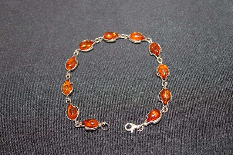 Sterling Silver bracelet with Amber stones & all of the stones have inclusions in them. image