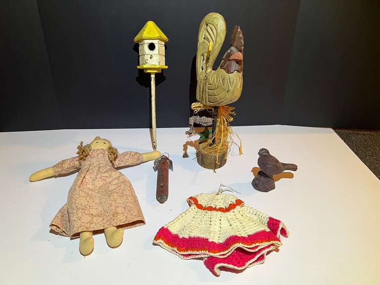 BR3…Assorted rustic household decor, includes a carved wooden chicken, wooden bird figurine, folk art doll, and more. See pictures for details. image