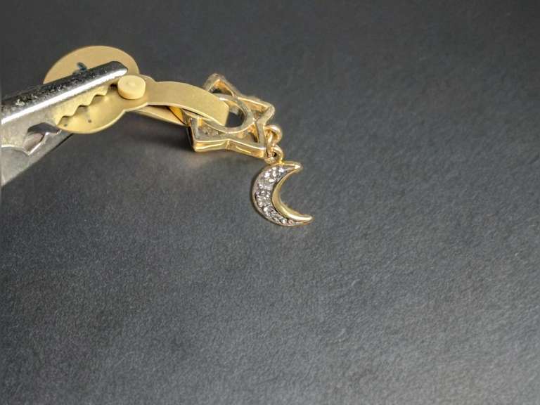 14k Gold Star and Moon Story Wheel Charm 2.3 Grams image