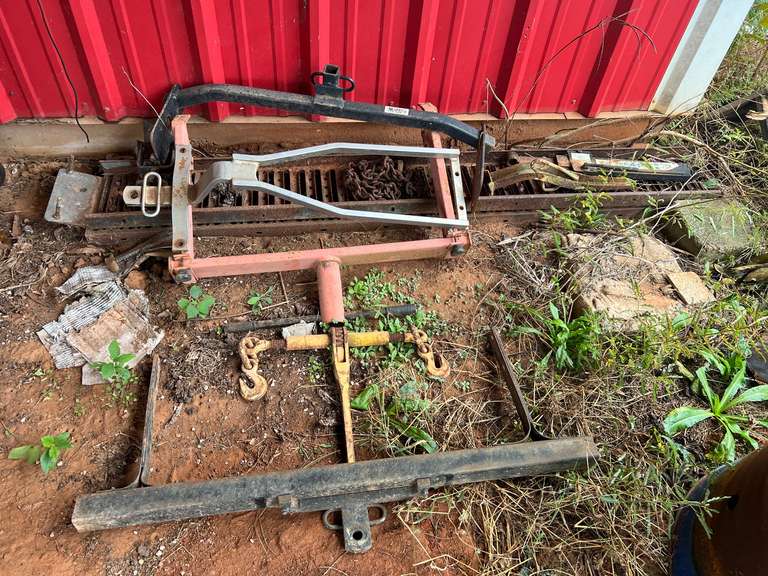 Set of two metal loading ramps, chain binder, and three various type trailer hitches image