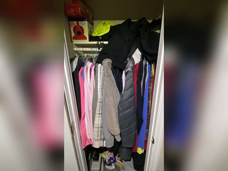 Hallway… Closet lot marked 1540 to include assorted jackets, clothing, and more. See pictures for details. image