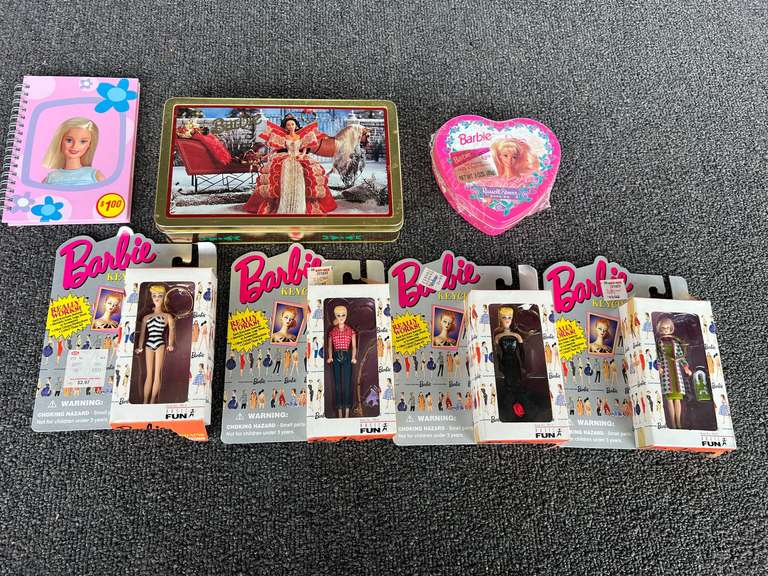 Assorted Barbie keychains, Barbie collectible tin, and more. See pictures for details. image