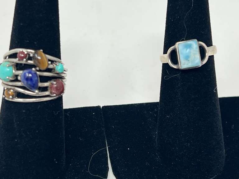 Ladies rings, both pieces are stamped 925, includes one with a unique stone that resembles Larimar, and a multistone ring featuring stones that resemble turquoise, lapis lazuli, tiger eye, and more. See pictures for details. image