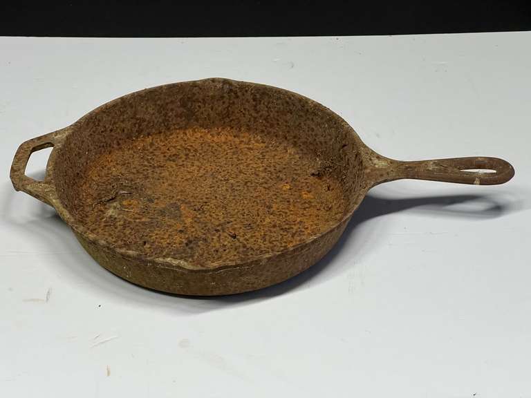 Lodge cast-iron frying pan, this piece will need cleaning and re-seasoning, see pictures or details. image