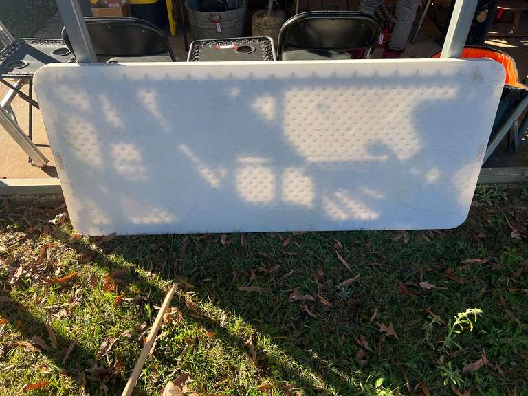 Portable 6’ plastic table, see pictures for details. image