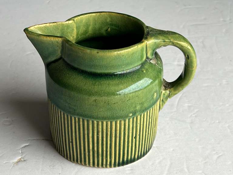 Vintage creamer, believed to be vintage Hull pottery, the handle has been broken and re-glued, see pictures for details. image