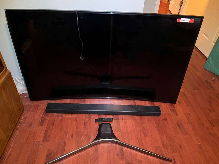 BR3… Samsung 65” television with sound bar and remote, powers up, with stand, see pictures for details. image