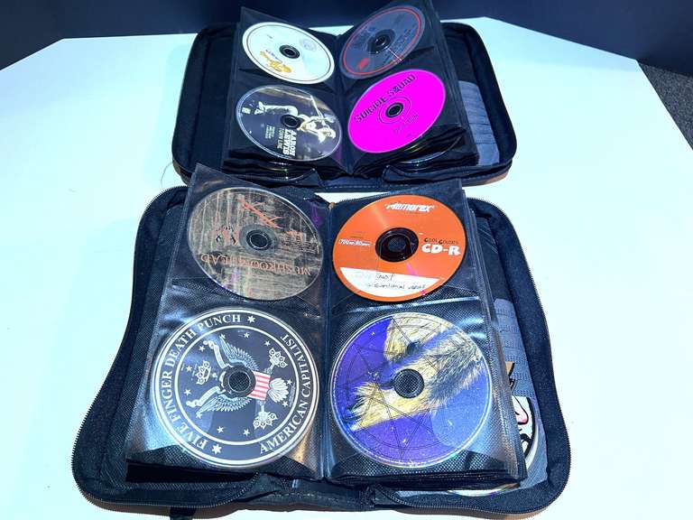 BR1…Assorted CDs, with storage cases, see pictures for details. image