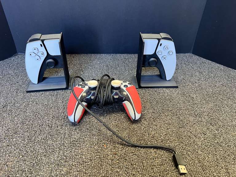Gaming controller also includes stands designed to hold two PlayStation 5 (PS5) DualSense controllers. See pictures for details. image