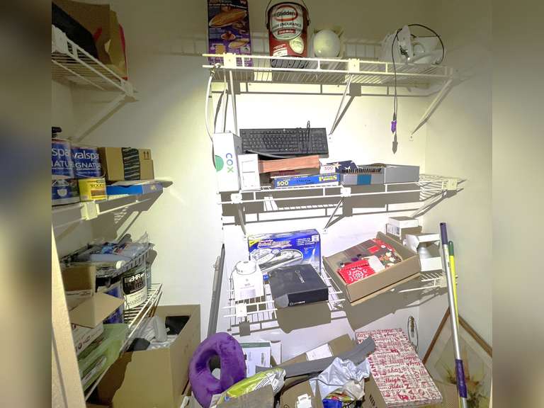 DEN… Closet lot marked 1384, includes entire content of closet. Items include assorted paints, small lampshades, artwork, children’s books, and much more. See pictures for details. image