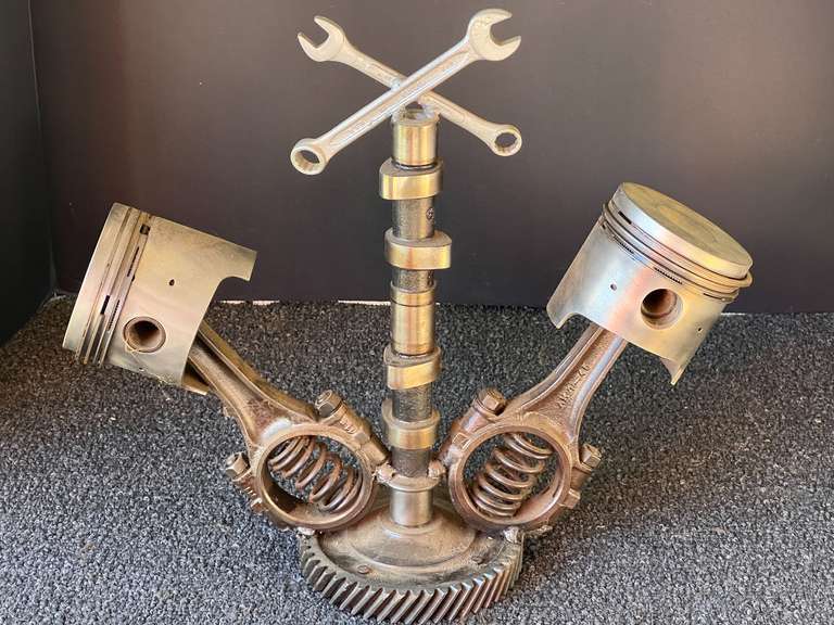 Unique automotive sculpture fashioned from pistons, camshaft, and more. image