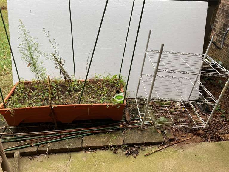 Coated wire metal shelving, also includes a planter and assorted stakes, see pictures for details. image