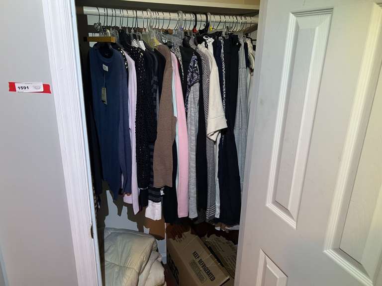 BR3… Closet lot marked 1591, includes all content. Items include assorted clothing, bedding, and more. See pictures for details. image