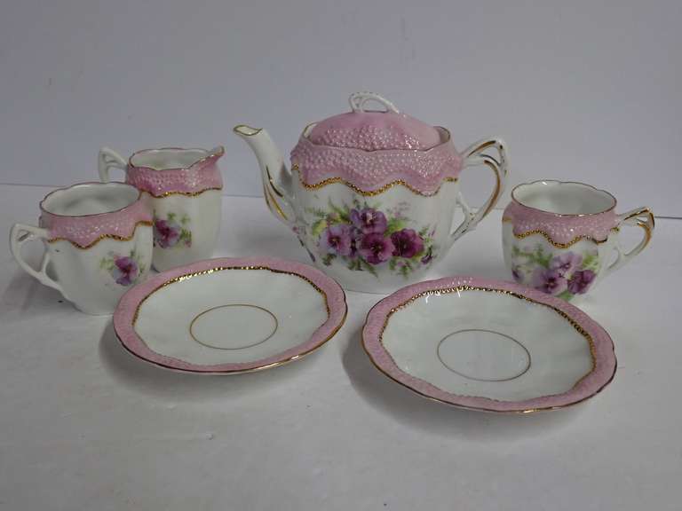 Collectible Porcelain Tea Set with Pink and Floral Design image