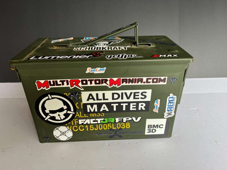Metal ammo can with content of assorted batteries typically used for remote control cars and drones, see pictures for details. image