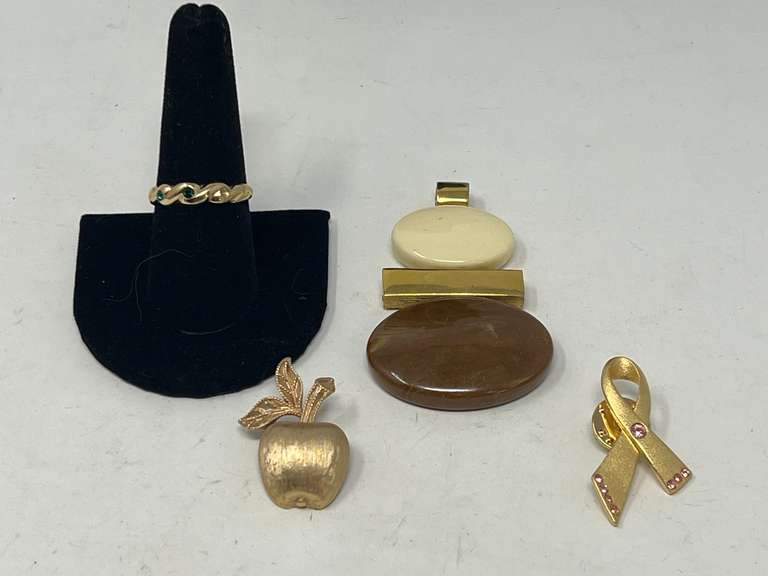 Vintage Avon jewelry to include a pendant, pins, and a ring. See pictures for details. image