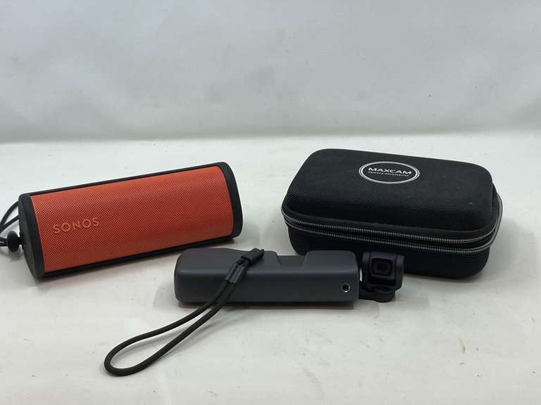 LR…DJI Pocket handheld camera with stabilizer and do it all handle microphone, comes with storage case, working condition unknown, also comes with a Sonos Bluetooth speaker, powers up, see pictures for details. image