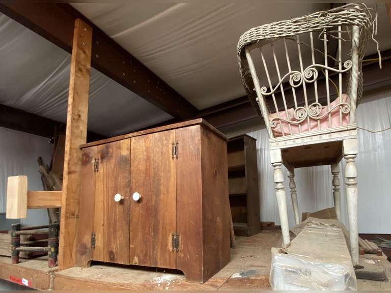 Content of above floor shelf marked 5041 to include an antique wicker bassinet, wooden ironing boards, antique wash station, wood cabinet, and more. See pictures for details. image