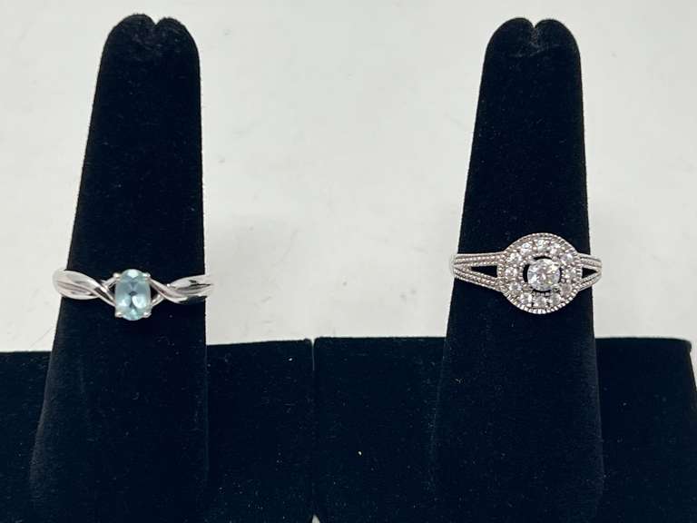 Ladies rings, both pieces are stamped 925, includes a lovely cluster ring, and one with a blue stone that resembles blue topaz, see pictures for details. image