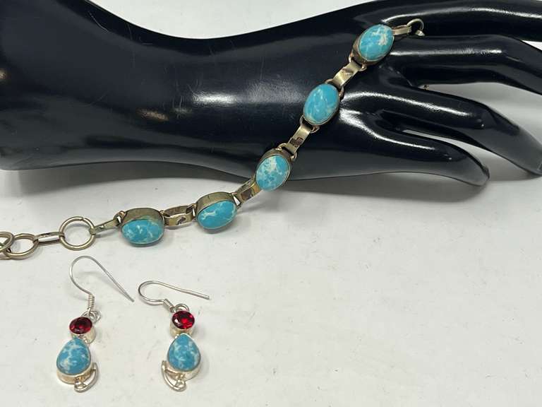 Ladies silver bracelet and earrings, stones resemble Larimar, both are stamped 925, earrings also contain ruby colored stones, see pictures for details. image