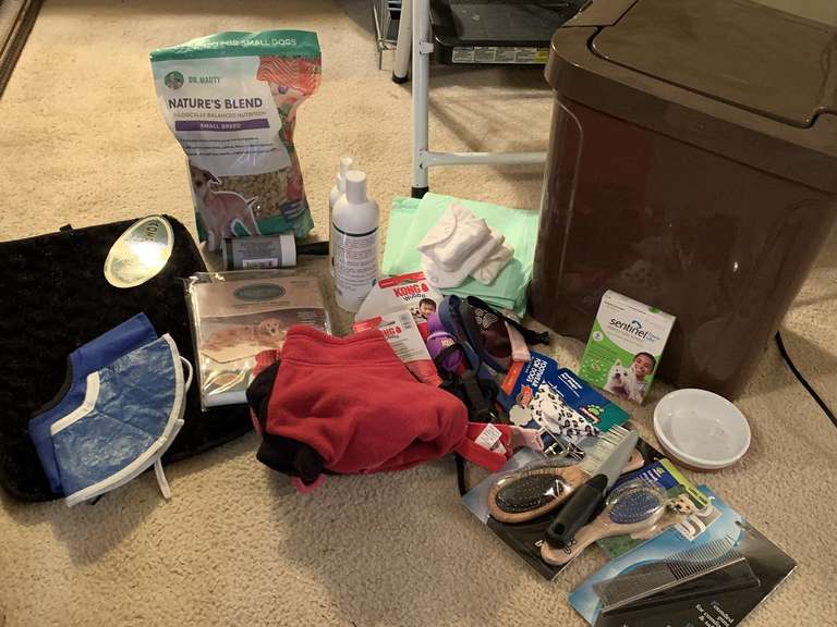 BROWN TRASH CAN/DOG FOOD CONTAINER FULL OF PET SUPPLIES TO INCLUDE NEW CRATE LINER, DR MARTIN DOG FOOD, DOG SWEATERS & MORE - UP MASTER CLOSET 1 image