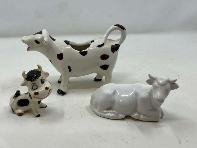 LR… Cow figurines, also includes a cow creamer, three pieces total, see pictures for details. image