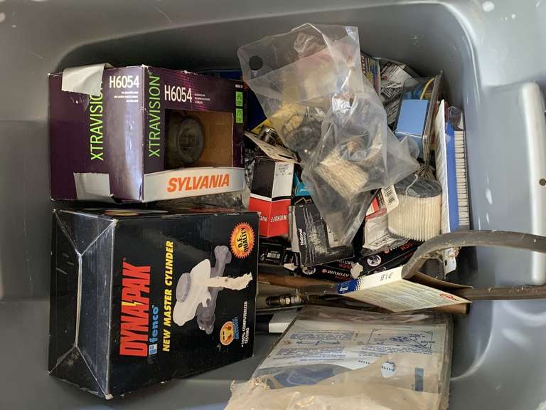 CRATE FULL OF MOSTLY NEW CAR & SMALL ENGINE REPLACEMENT SUPPLIES - AIR FILTERS, MASTER CYLINDER, NEW HEADLAMP, SPARK PLUGS & MORE - GARAGE image