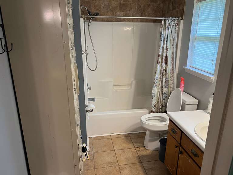 Master bath… Bathroom lot to include two locker banks with six lockers each with content of assorted toiletries, and perfumes, also includes vintage scale, home decor, and more. See pictures for details. image