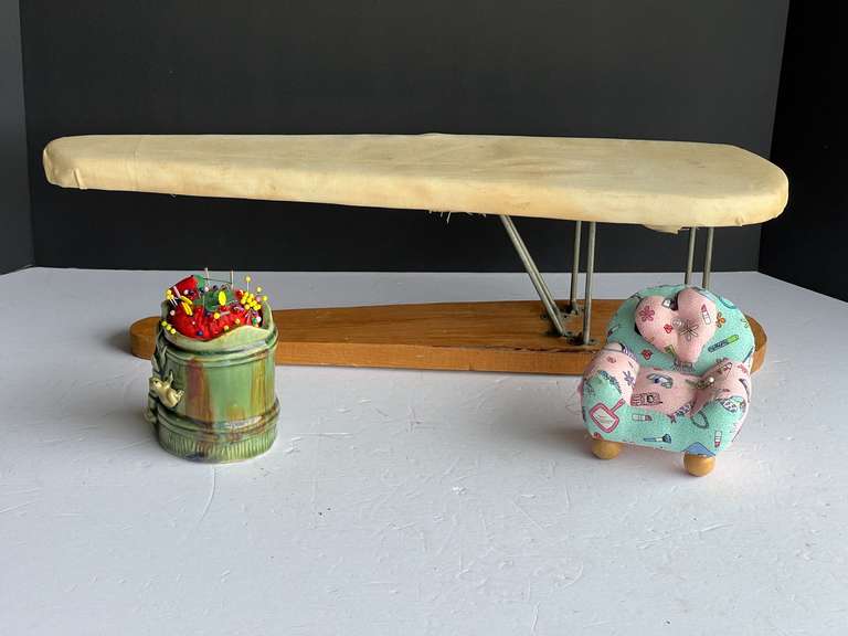 Sewing accessories to include a small ironing board, pin cushions, and more. See pictures for details. image