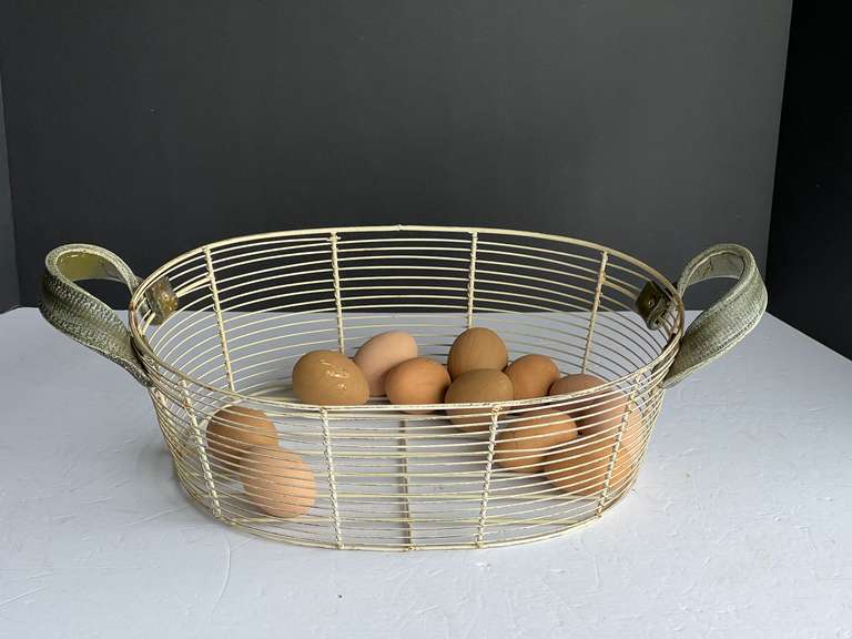 Vintage coated wire basket with faux eggs, see pictures for details. image