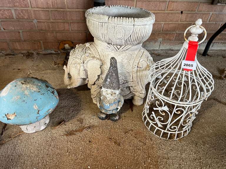 Assorted home/yard decor to include a coated wire bird cage, back hinge is broken, also includes an elephant planter, and garden mushroom, this piece is peeling, see pictures for details. image
