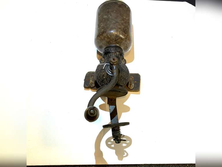 LR…Antique wall-mounted coffee grinder, an "Arcade Crystal" model, see pictures for details. image