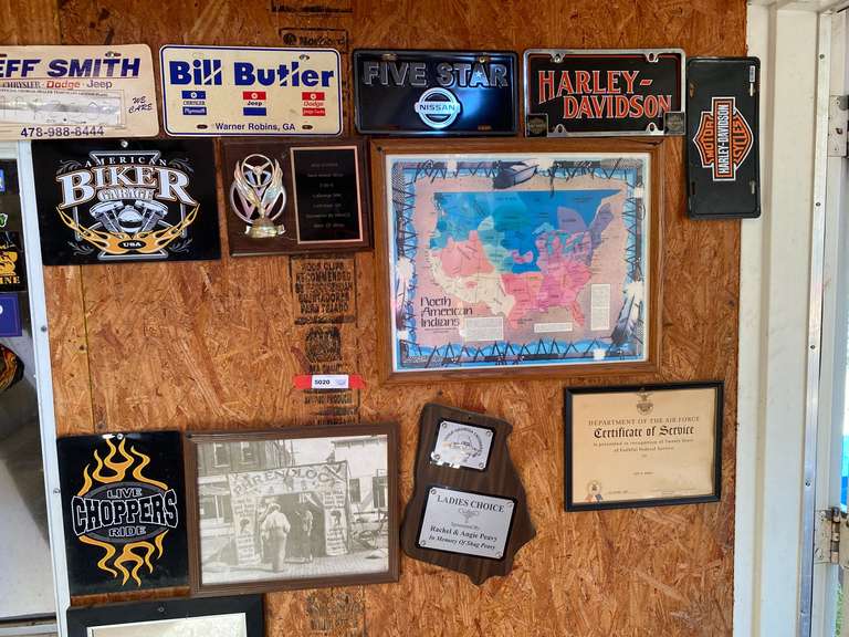 Decor on side wall to include framed photographic prints, plaques, and Moore. See pictures for details. image