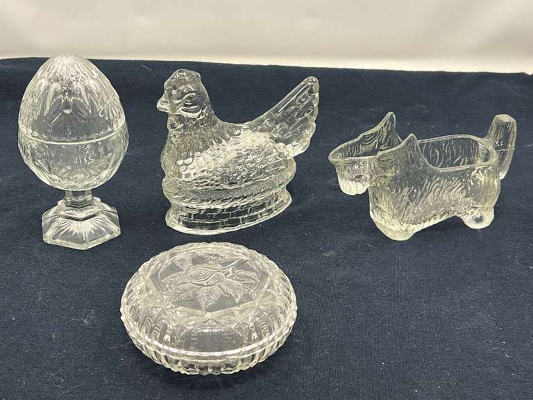 DEN… Vintage glass trinket dish with floral motif, footed egg shaped trinket dish, believed to be vintage Avon, clear glass hen on a nest, believed to be vintage candy container from JH Milstein, and a vintage Scotty dog creamer, see pictures for details. image