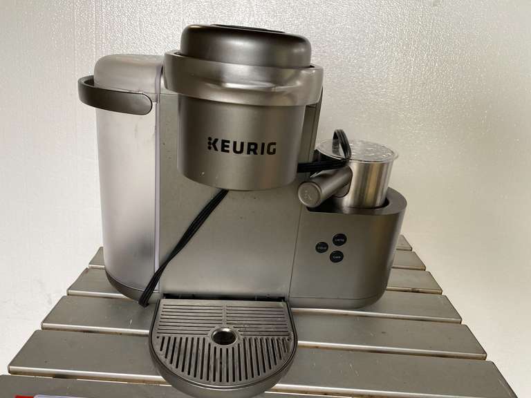 Field & Stream metal folding table, also comes with a Keurig coffee machine, working condition unknown, see pictures for details. image