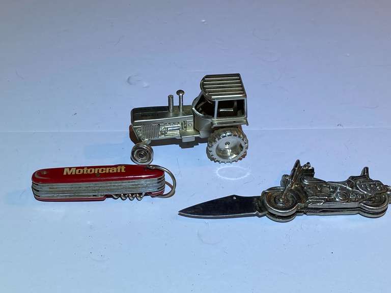 BR1… Motorcraft pocket knife, Harley Davidson motorcycle themed pocket knife, also includes a Novelty Tractor Desk Clock, small clock face is missing from tractor wheel, see pictures for details. image