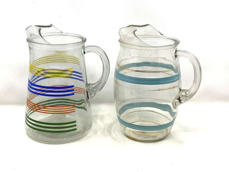 KIT… Vintage glass pitchers to include (MCM) Orbit Stripe glass pitcher with blue and gold rings, and one with a rainbow stripe design, believed to be vintage Anchor Hocking, see pictures for details. image