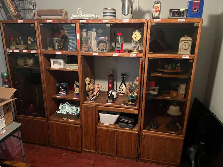 BR3…Large three-piece entertainment armoire, THIS PIECE WILL REQUIRE PICKUP IN THE LATE AFTERNOON ON THE SECOND DAY, one of the short glass doors has been removed but is included, items shown in pictures are sold in separate lots, see pictures for details. image