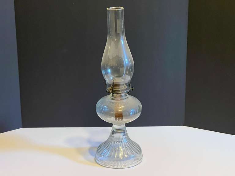 LR… Vintage oil lamp with fluted base and glass chimney, see pictures for details. image