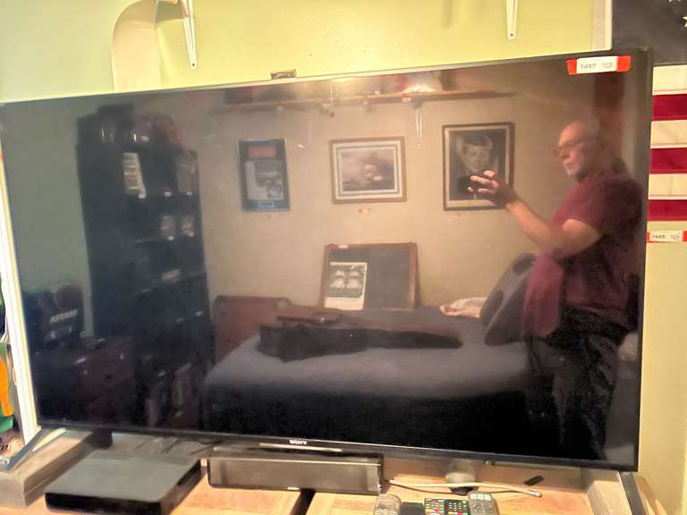 BR2.. Sony 65“ television, powers up, comes with a Bose theater system, and remotes, see pictures for details. image
