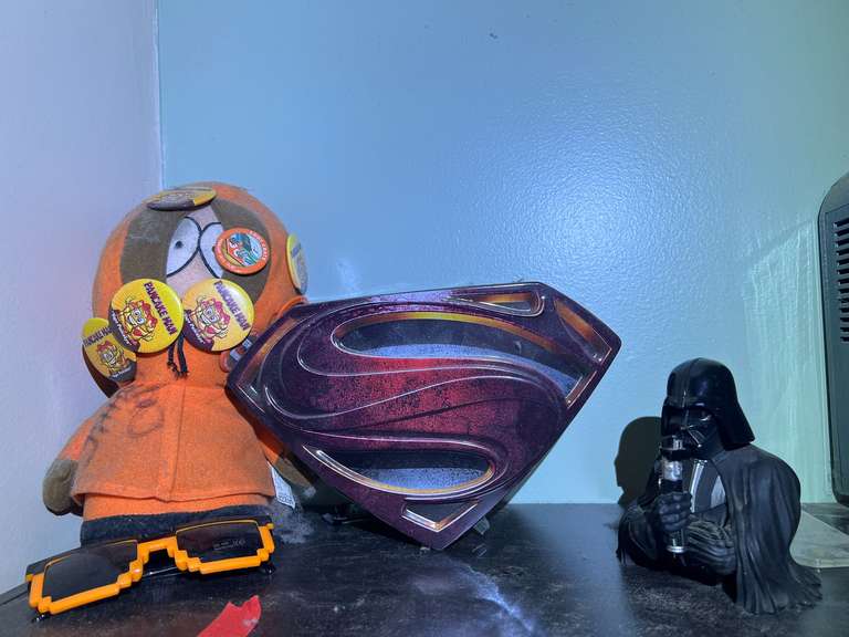 BR2…Assorted items to include a Darth Vader bust, Superman DVDs with collectible tin, and South Park stuffed toy, see pictures for details. image